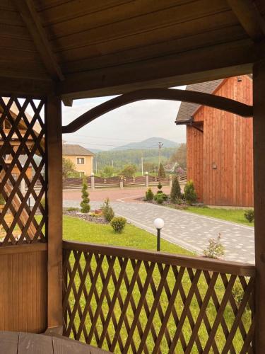 an open porch with a view of a driveway at Four Seasons In Carpathians in Migovo