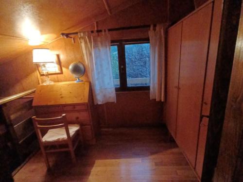 a room with a desk and a chair and a window at Chalet Autrans-Méaudre en Vercors-Autrans, 4 pièces, 8 personnes - FR-1-737-20 in Autrans