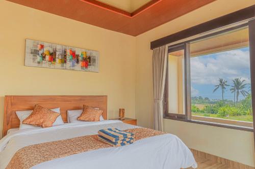 Säng eller sängar i ett rum på Jnana Bali Villa