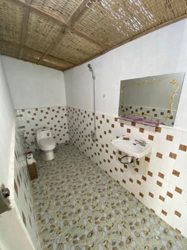 a bathroom with a sink and a toilet at Sok Sabay in Koh Rong Island