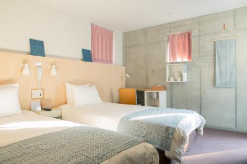 Postel nebo postele na pokoji v ubytování DOMO Hotel