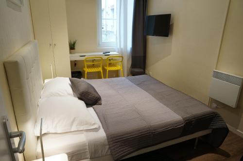 Postel nebo postele na pokoji v ubytování Hotel Zora