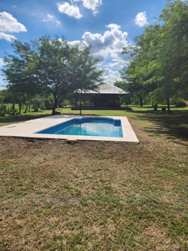 a swimming pool in the middle of a yard at Casa Gande in San Fernando del Valle de Catamarca