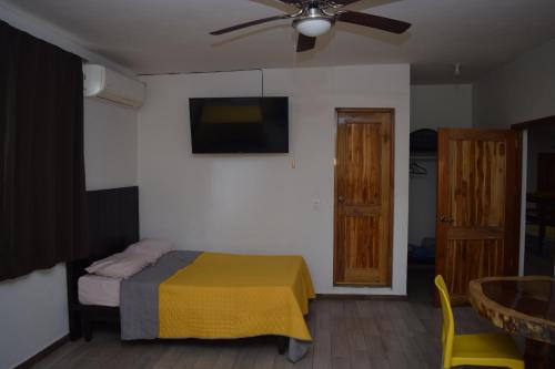 Кровать или кровати в номере Estancia Vacacional 20 Aguas