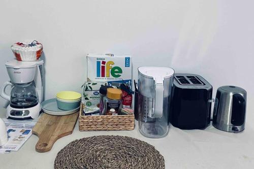 a kitchen counter with a coffee maker and a blender at Richmond Cozy Place 2 in Richmond
