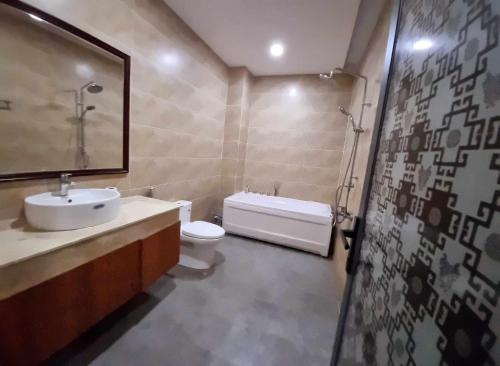 a bathroom with a sink and a toilet at Homestay Thule in Ho Chi Minh City