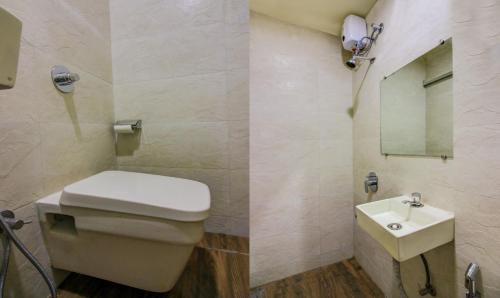 a bathroom with a toilet and a sink at ZEST STAYS - MEADOW INN 1058 in Mumbai