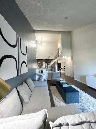 a living room with a couch and a table at SFO Airport/S San Francisco Sweet Home in South San Francisco