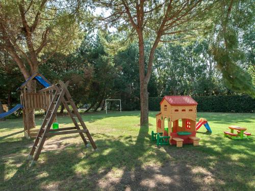 a playground with a slide and a swing set in a park at Agriturismo Ai Prati in Perugia