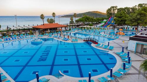 an image of a large swimming pool at a resort at Kustur Club Holiday Village - All Inclusive in Kusadası