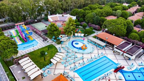 an aerial view of a water park with a pool at Kustur Club Holiday Village - All Inclusive in Kusadası