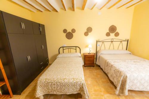 A bed or beds in a room at Vivienda Puente de Tramaya