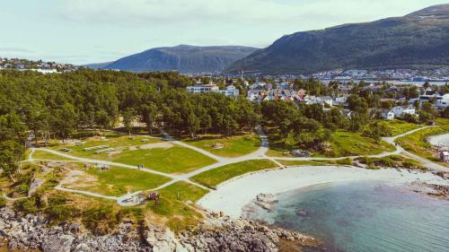 an aerial view of a town and a body of water at Arctic Homestay with Northern light view room in Tromsø