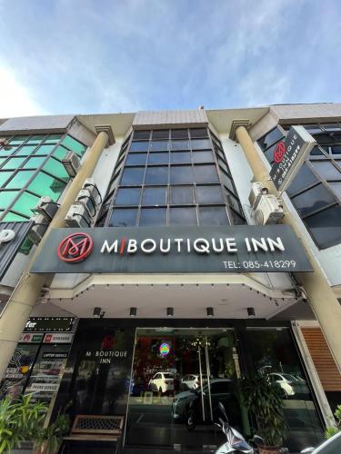 a store front of a building with a sign on it at M BOUTIQUE INN (BINTANG JAYA) in Miri