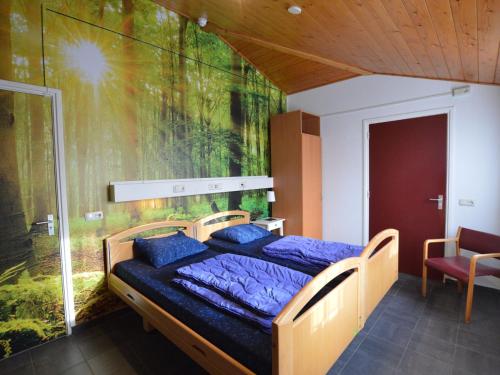 a bedroom with a bed with a painting on the wall at Welcoming Mansion near Forest in Bergeijk in Bergeijk