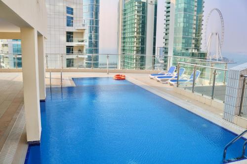 a swimming pool on the roof of a building at Bellehomez in Dubai