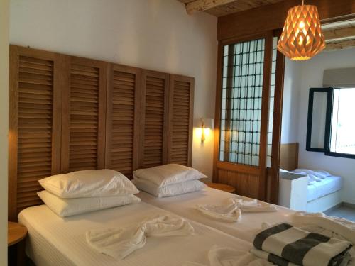 Voodi või voodid majutusasutuse Hotel Porto Loutro on the Hill toas