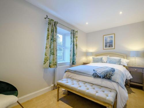 a bedroom with a bed and a window at 1 Bed in Lockerbie 86068 in Lockerbie