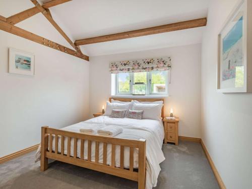 a bedroom with a bed and a window at 3 Bed in Shaftesbury 87724 in Sedghill
