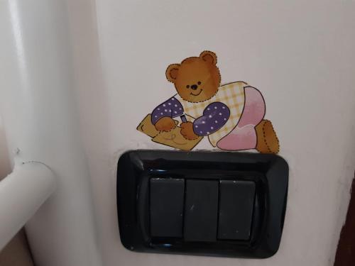 a teddy bear sitting on top of a switch at La Tana degli Orsetti in Barrea