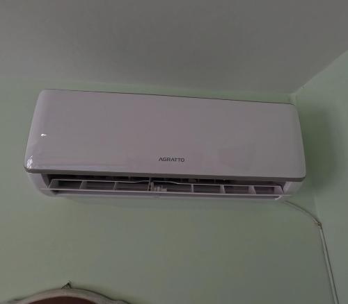 a laptop computer sitting on top of a wall at Santinho Hostel in Florianópolis