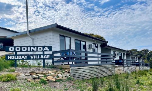 a building with a sign that reads corona holiday village at Cooinda Holiday Village Cabins in American River