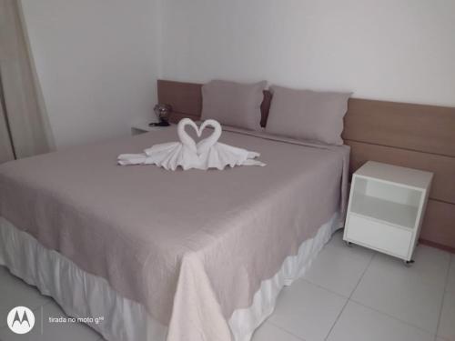 Uma cama ou camas num quarto em Iloa Residence Luxo