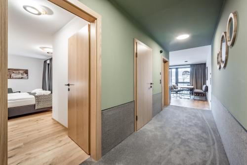 a hallway with a door leading to a bedroom at Summit Seefeld in Seefeld in Tirol
