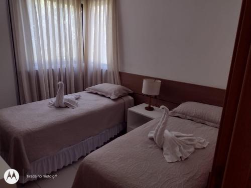 Säng eller sängar i ett rum på Iloa Residence Luxo