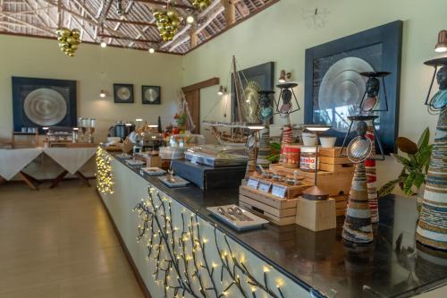 a store with a counter with items on it at Alma Boutique Hotel in Jambiani