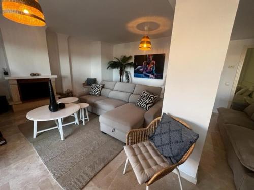 a living room with a couch and a table at Center beach 2 beds Appartement Elviria in Marbella