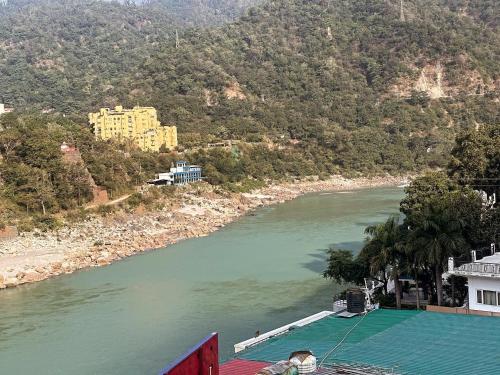 a view of a river with a tennis court at The Peninsulla in Rishīkesh