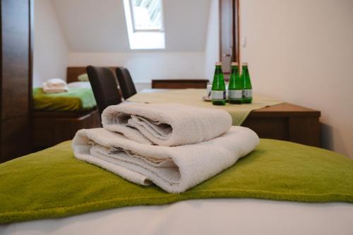 a pile of towels sitting on top of a table at Majláthova Chata Popradské Pleso in Vysoké Tatry