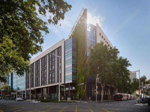 a rendering of a building on a city street at Sofitel Barcelona Skipper in Barcelona