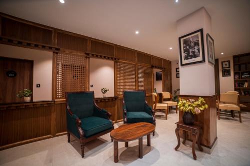 a waiting room with two chairs and a table at Zip By Spree Hotels Gangtok in Gangtok
