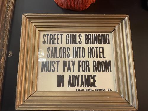 a framed picture of a sign on a wall at The Twenty One in Brighton & Hove
