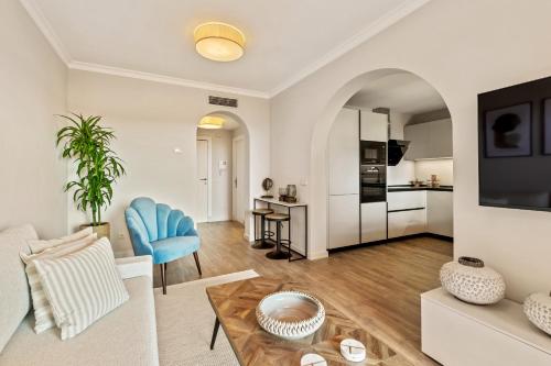a living room with a couch and a table at Royal Marbella Golf Resort in Estepona