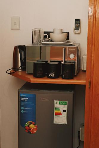 a kitchen with a counter on top of a refrigerator at Renosterberg by KLG in Kimberley