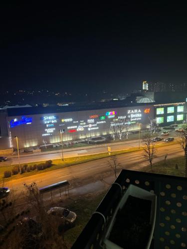 a view of a city street at night with a building at Amina in Tuzla