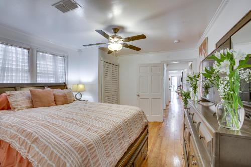 a bedroom with a bed and a ceiling fan at Cadillac Cottage about 3 Mi to French Quarter! in New Orleans