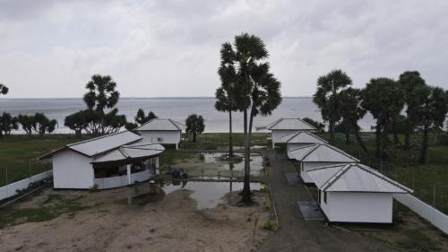 an aerial view of a group of houses and trees at Palm Beach Resort Ceylon in Jaffna