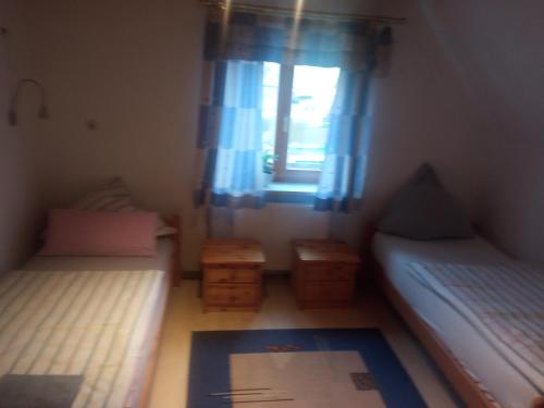 Ein Bett oder Betten in einem Zimmer der Unterkunft Karolingerweg