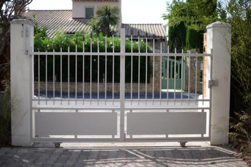 a gate in front of a house at Bel Appartement En Haut de Villa in Sanary-sur-Mer