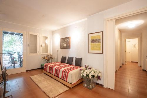 a bedroom with a bed and chairs in a room at Villa Margherita Sardegna 250m from the beach in Fort Village