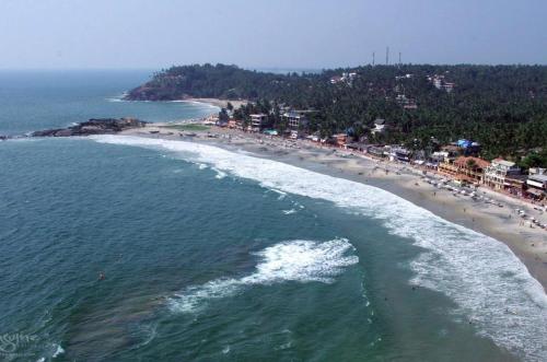 an aerial view of a beach with people on it at Beach Villa Kovalam in Kovalam