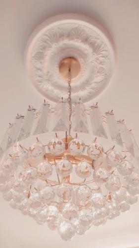 a chandelier with a chandelier with boats on it at L Suites The Writer's House in Gythio