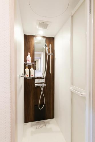 a bathroom with a shower in a room at KYO SAKURA Shimabara 2F in Kyoto