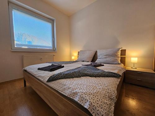 Postel nebo postele na pokoji v ubytování Horský apartmán s oplocenou zahradou