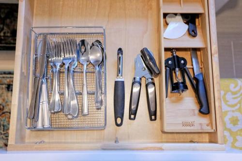 a wooden drawer with utensils in it at New2/2 Garden Apartment Historic in Savannah