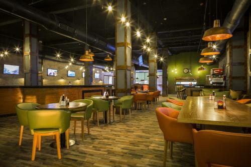 a restaurant with tables and chairs and lights at Grand Palladium Jamaica Resort & Spa All Inclusive in Lucea